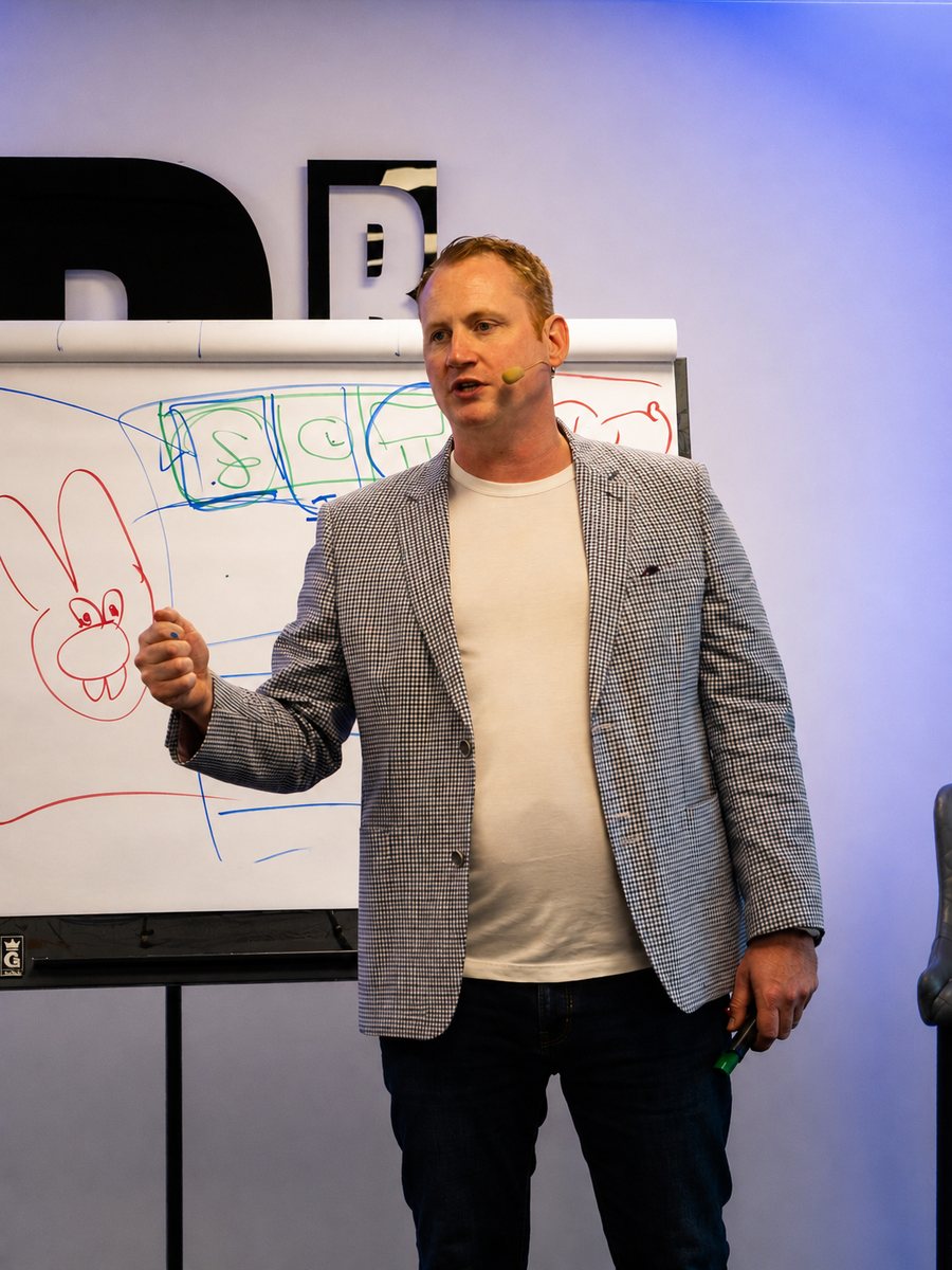 Adam Stott teaching at a flipchart at a Business Scale Up Day