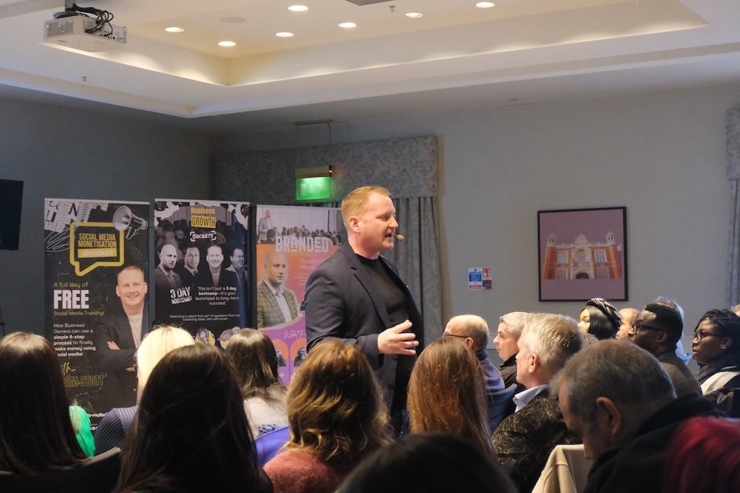 Adam Stott teaching a room of business owners